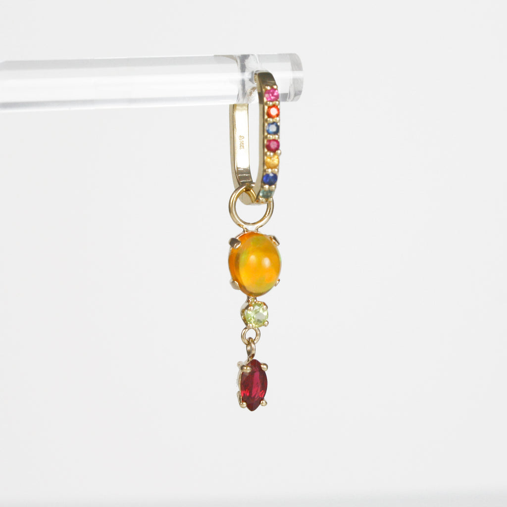 Unique earring charm featuring a deep red Ruby hanging from a soft green peridot and a Mexican orange crystal opal with grren-orange-red fire.